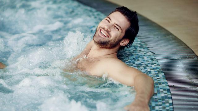 Woman relaxing in outdoor spa
