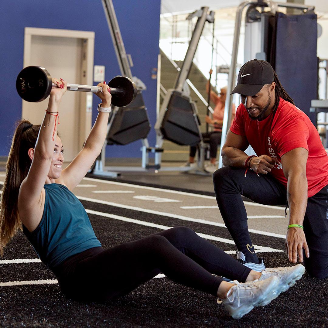 Woman working out with a personal trainer
