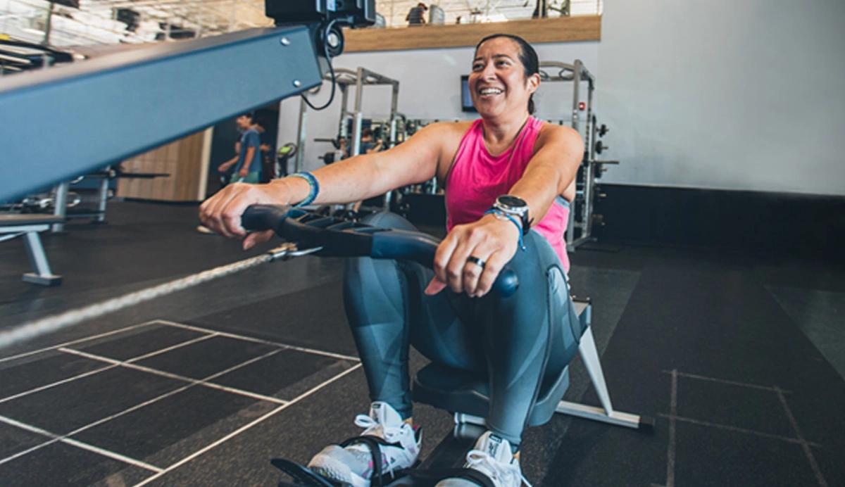 Photo of woman using a row machine