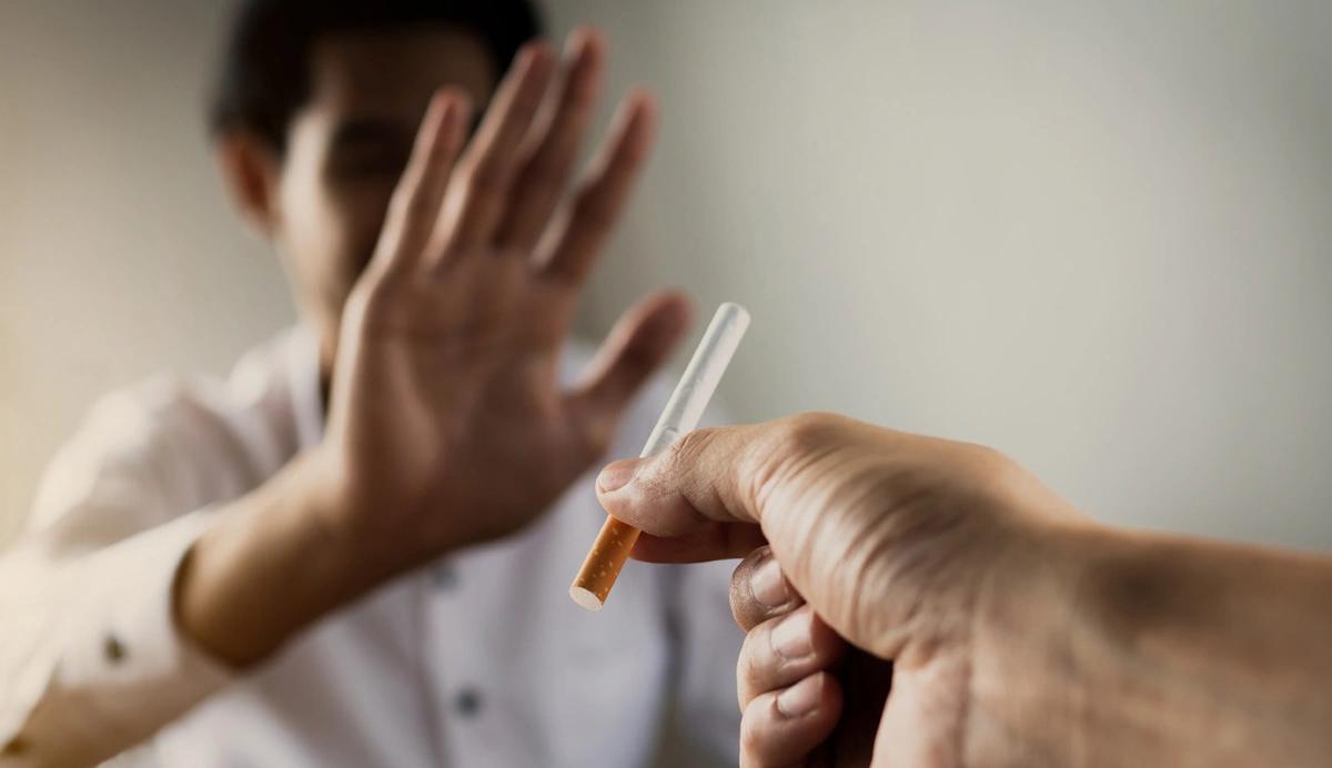 person refusing offered cigarette
